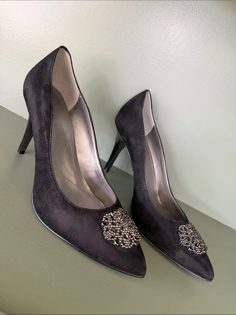 Tahari Black Pointed-Toe Heels with Metallic Brooch Detail